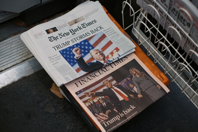 New York Times and Financial Times newspapers on a Paris newsstand featuring Trump headlines