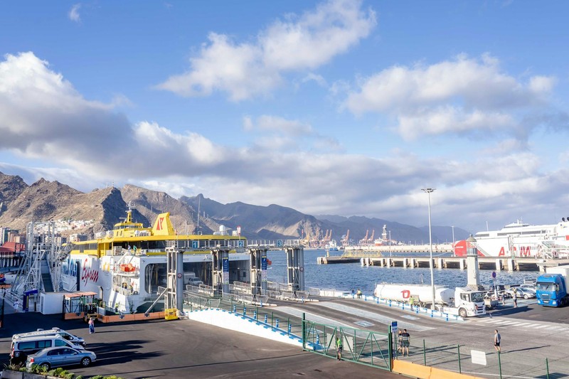 Cruise ship docked at Santa Cruz de Tenerife harbor with mountains in the background