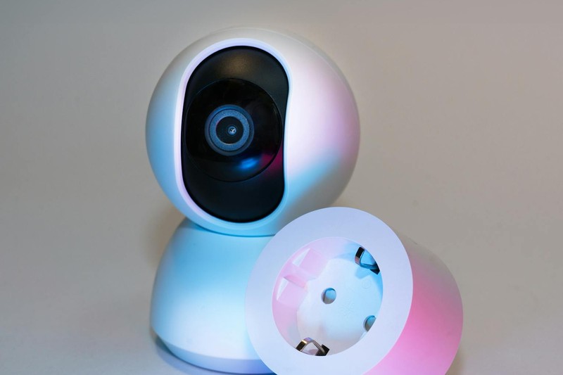 Smart home security cameras on a white desk