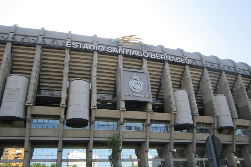 Exterior view of the Estadio Santiago Bernabéu, home of Real Madrid, on a sunny day