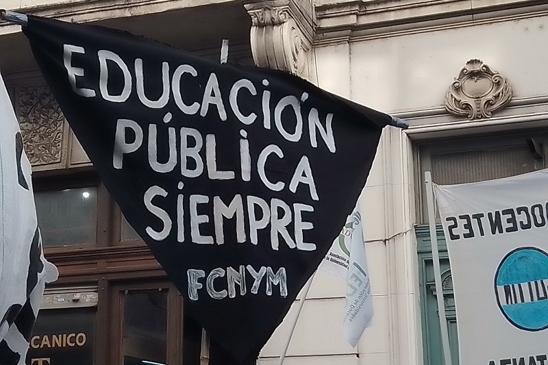 Protesters holding a banner reading 'Educación Pública Siempre' (Public Education Always) during the April 2024 university march in Buenos Aires, Argentina
