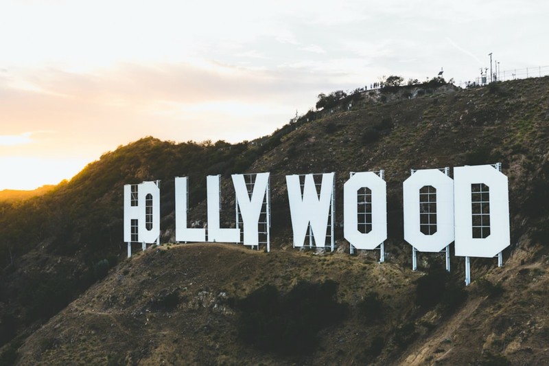 The iconic Hollywood sign on a sunlit hillside in Los Angeles, California