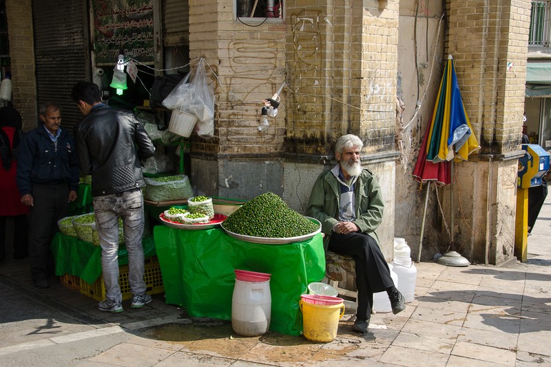 People gathered at a produce stall in the Tajrish neighborhood of Tehran, Iran