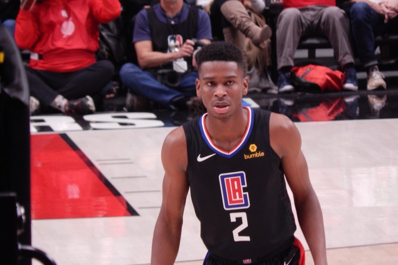 An NBA player in a Los Angeles Clippers jersey stands on court during a game against the Portland Trail Blazers at Moda Center