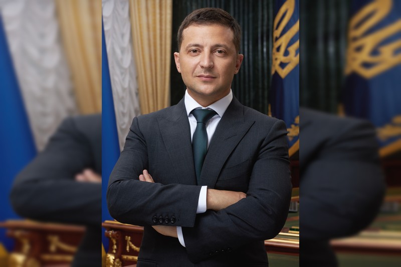 Official portrait of Ukrainian President Volodymyr Zelenskyy with Ukrainian flag and national emblem