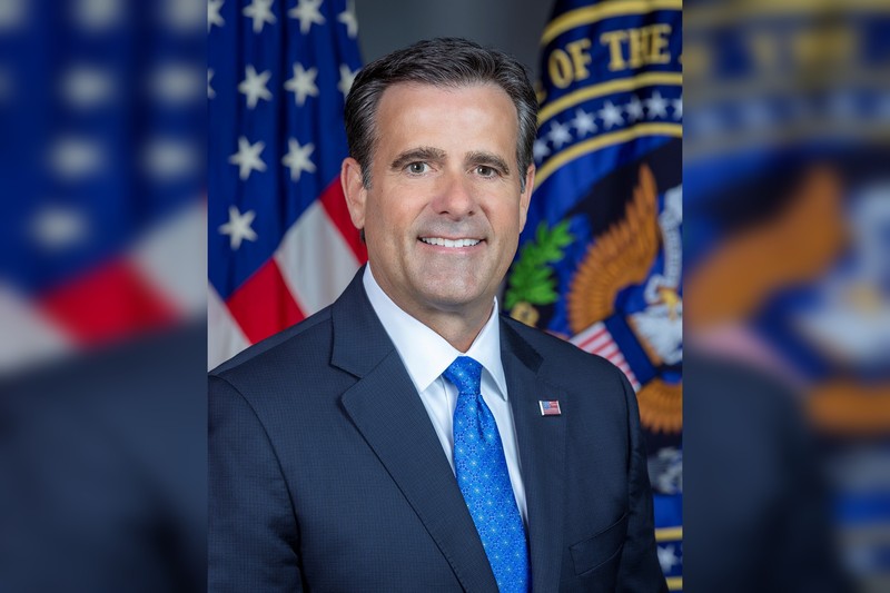 Official portrait of CIA Director John Ratcliffe in front of the American flag and an official government seal