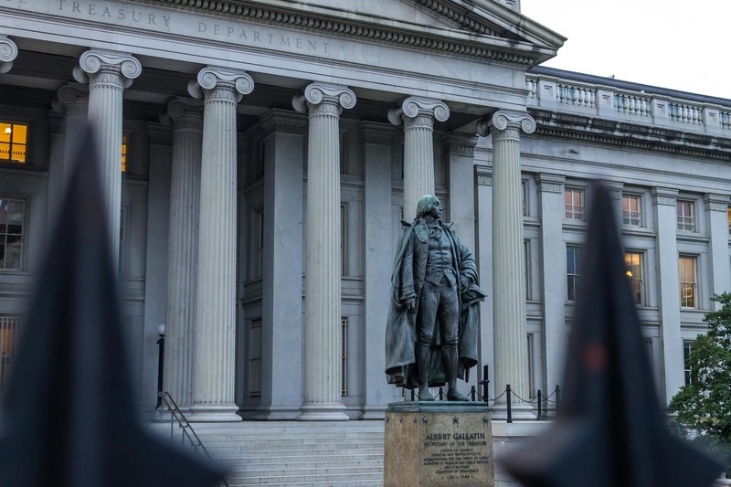 Statue in front of the neoclassical US Treasury Department building in Washington, DC