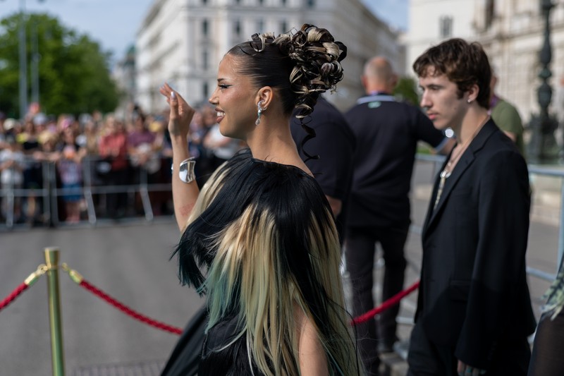 DARA representing Bulgaria waves to fans on the Turquoise Carpet at the 2026 Eurovision Song Contest in Vienna