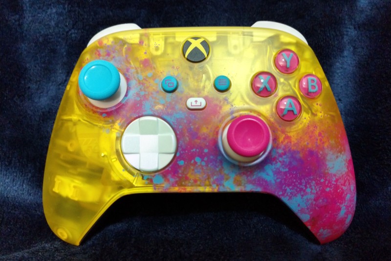 A custom Forza Horizon 5 themed Xbox Wireless Controller with yellow, blue, and pink translucent design on a dark background