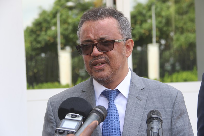 WHO Director-General Tedros Adhanom Ghebreyesus speaks at a press event with microphones