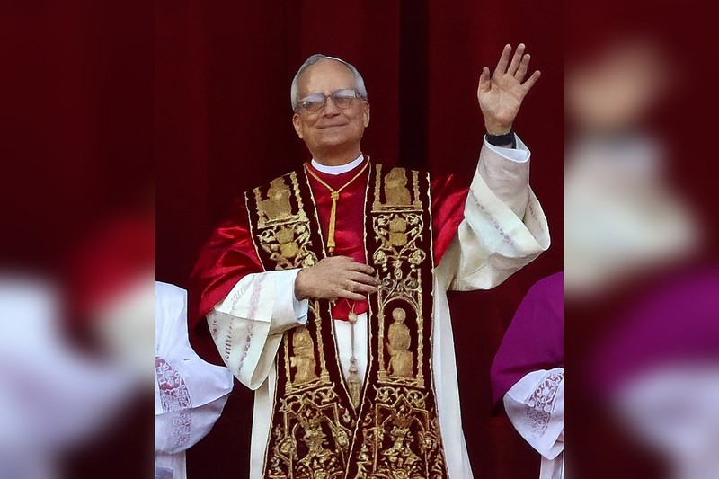 Pope Leo XIV waving from the loggia after his election, wearing red and gold papal vestments