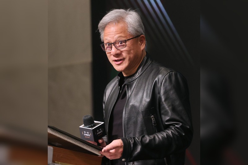 Jensen Huang, CEO of NVIDIA, wearing his signature black leather jacket at an event