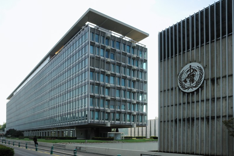 World Health Organization headquarters in Geneva, Switzerland, showing the main building complex with the WHO emblem on the facade