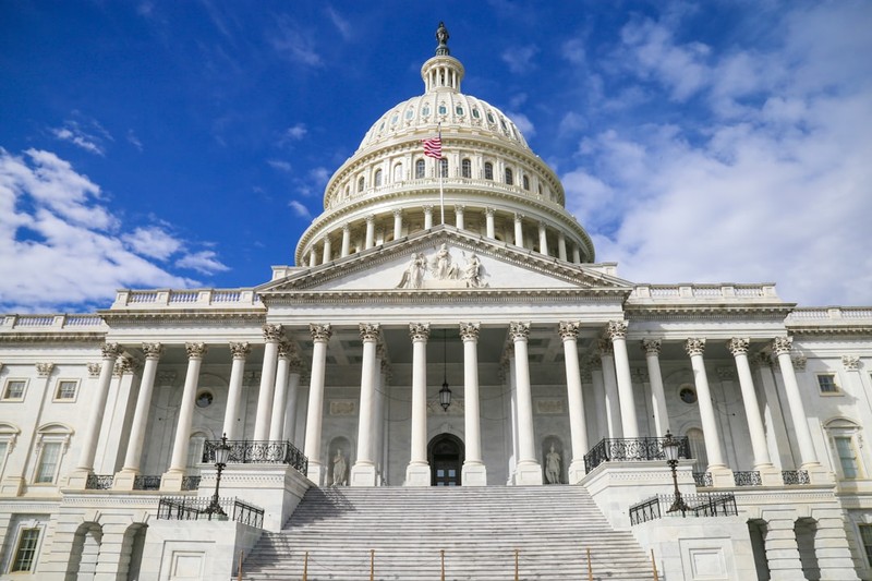 The United States Capitol building in Washington, D.C., viewed from the east front under a clear blue sky