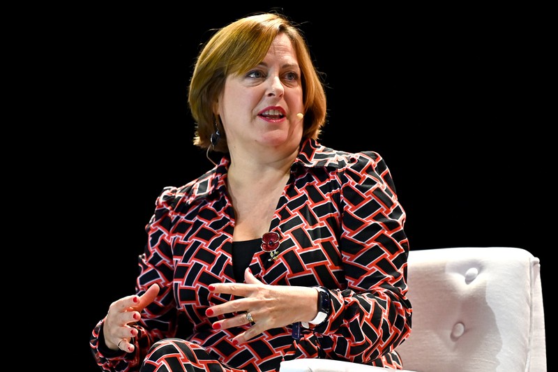 Dame Melanie Dawes, CEO of Ofcom, gesturing while speaking at Web Summit 2021 in Lisbon