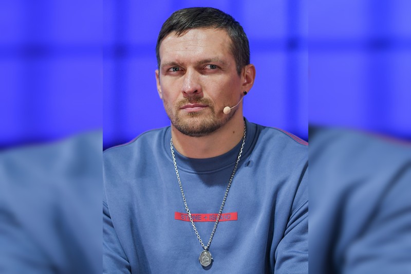 Oleksandr Usyk speaking on stage at Web Summit 2022 in Lisbon, Portugal