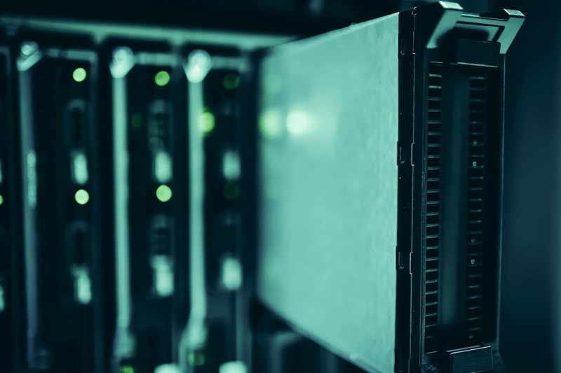 Close-up of server hardware in a blue-lit data center