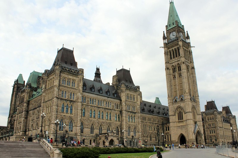Canada's Parliament buildings in Ottawa under an overcast sky