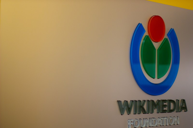 The Wikimedia Foundation logo mounted on a wall at the organization's San Francisco headquarters